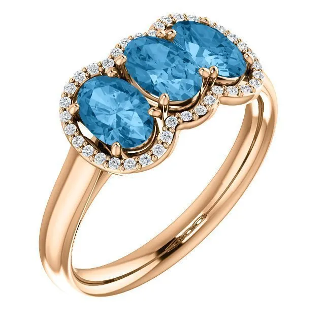 14KT GOLD 1.74 CTW BLUE TOPAZ & .10 CTW DIAMOND 3 STONE OVAL HALO RING