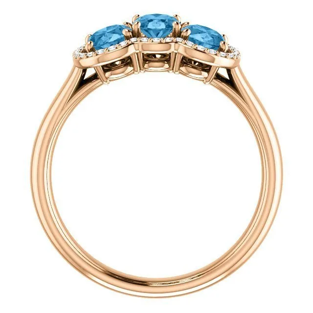 14KT GOLD 1.74 CTW BLUE TOPAZ & .10 CTW DIAMOND 3 STONE OVAL HALO RING