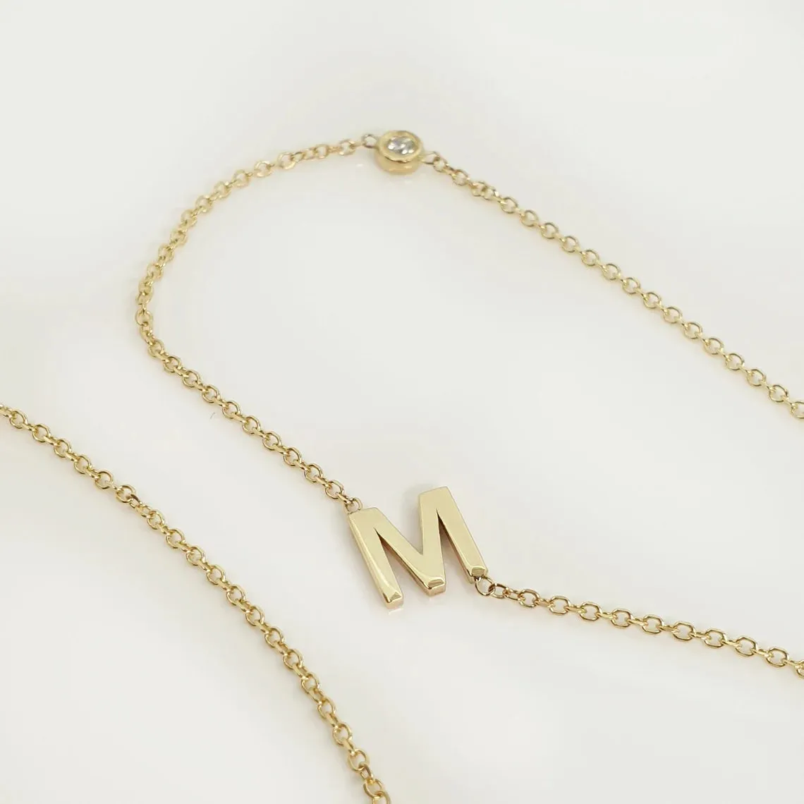 Sideways initial necklace